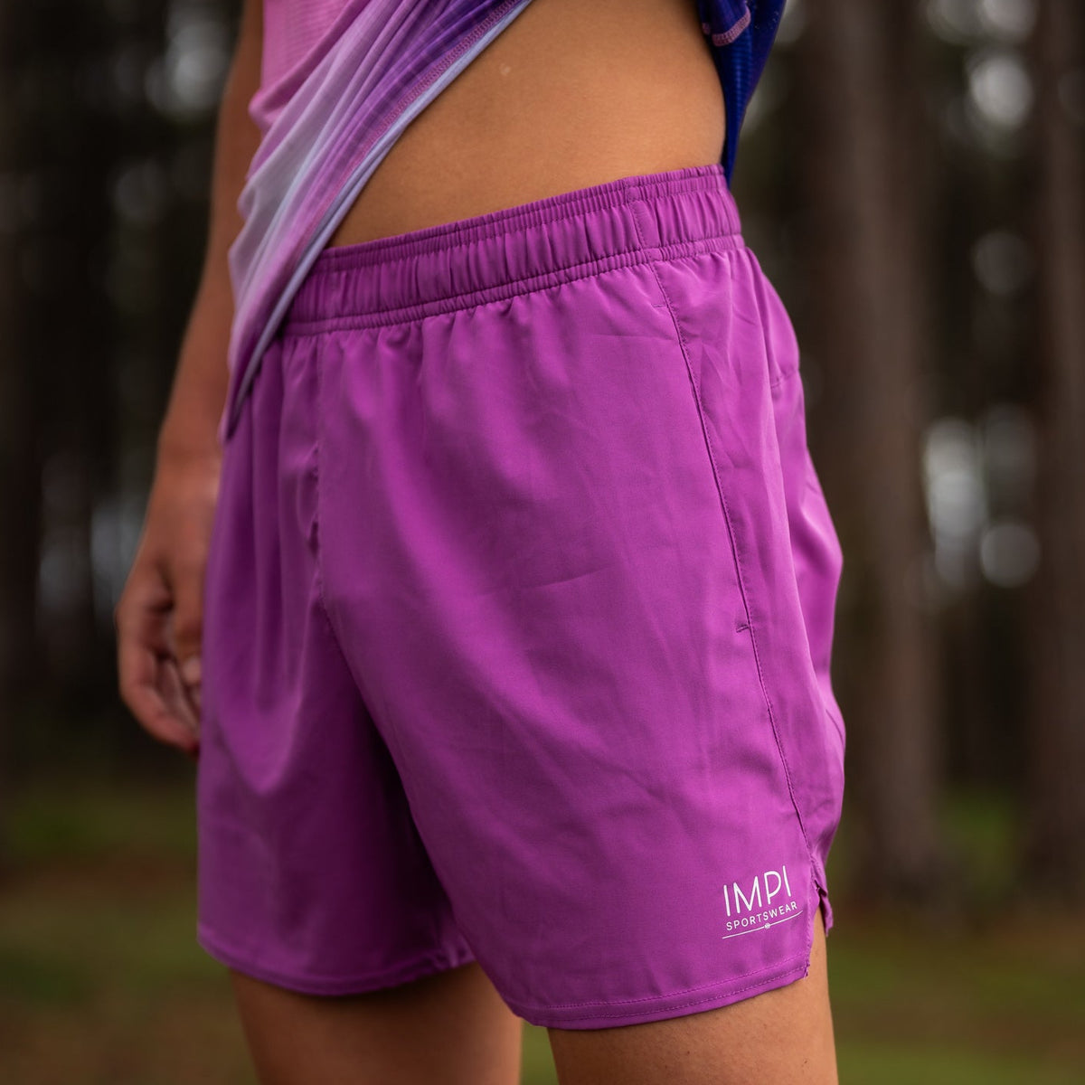 boys running purple shorts
