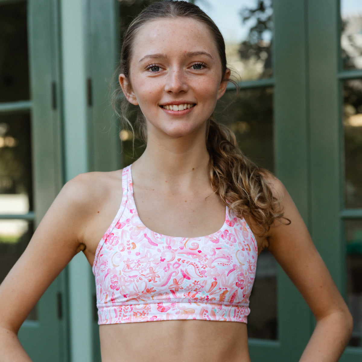 girls pink patterned sports bra